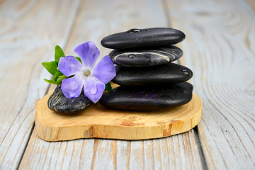 Naklejka na ściany i meble Black warmth zen stones decoration on old wooden background