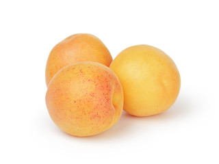 three ripe apricot fruits isolated
