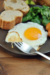 Fried eggs with bread and oil