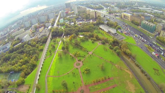 Day view: city panorama with aqueduct and high traffic