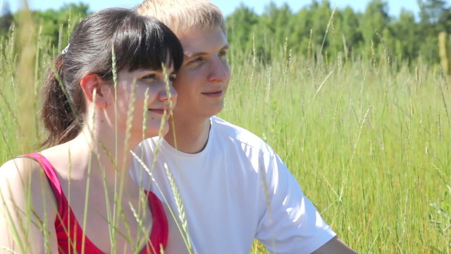 in high grass sit next guy to girl and look afar