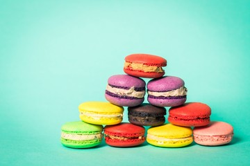 Hipster. Sweet and colourful french macaroons on retro-vintage