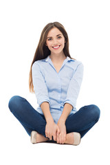 Casual woman sitting over white background