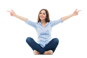 Young woman sitting and pointing