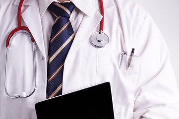 Male Doctor using a Digital Tablet
