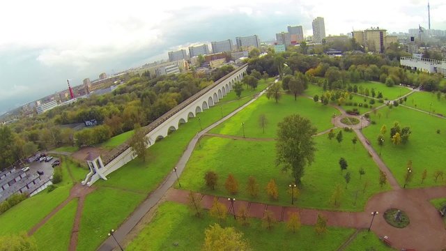 Day view: city panorama with aqueduct near park, aerial view