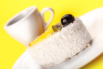 fresh coconut slice of cake and a cup