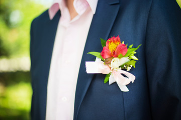 boutonniere flower on a groom