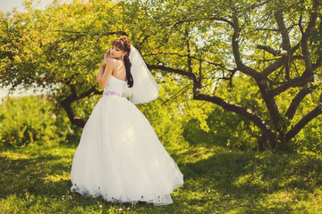 Beautiful bride outdoors in a forest.