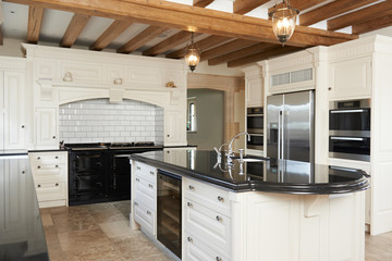 Luxury Fitted Kitchen In House With Beamed Ceiling
