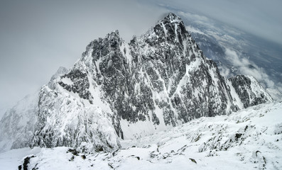 Fototapeta na wymiar snowed rock in clouds in Slovakia