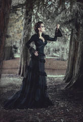 Woman in forest in black dress