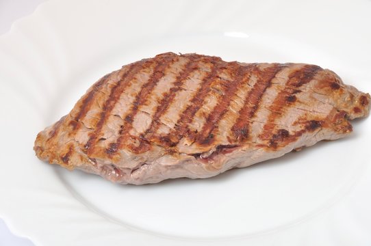 Grilled beef steak on plate