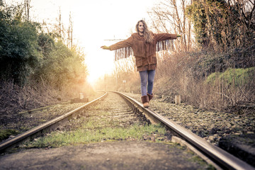 Woman walking on rail