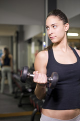 Fototapeta na wymiar Woman training biceps