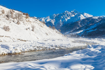 River in a mountain valley at winter