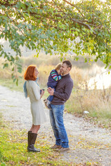 Fototapeta premium Young Attractive Parents and Child Portrait