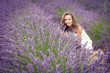 The joy of a beautiful young girl on the lavender field