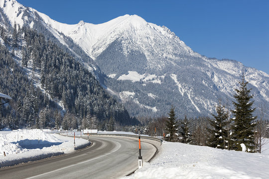 Alpine road in winter scenery