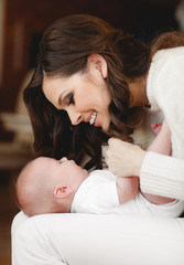 Happy mother with newborn baby