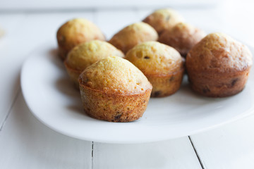 Homemade muffins in plate on table