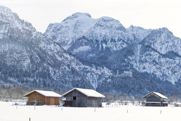 Fototapeta na wymiar Traditional wooden hut in snow, Alps, Germany, sun flare, reflec