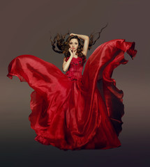 Woman in fluttering red dress