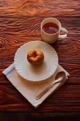 cup with tea and dessert
