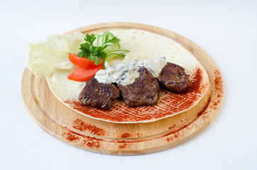 Minced meat with sauce on plate.