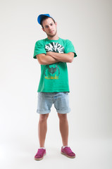 Young man wearing hip-hop style outfit