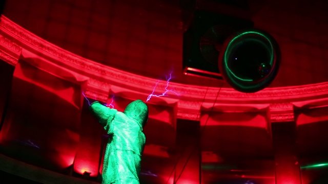 Man in mail and lightning at presentation of attraction