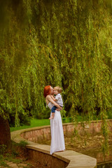 Caucasian baby boy take rest in summer park