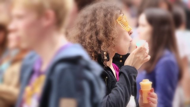 Woman blows soap bubbles in crowd at Russian bubble fest Dreamflash
