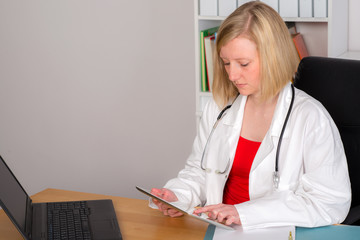 young female family doctor in her office