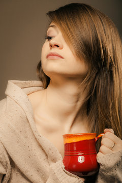 Beverage. Girl holding cup mug of hot drink tea or coffee