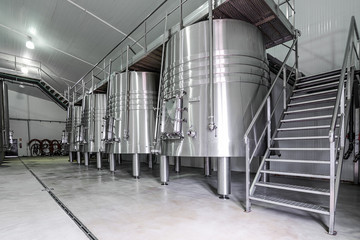 modern wine cellar with stainless steel tanks