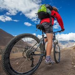 Biker-girl in Himalaya mountains, Anapurna region