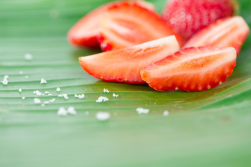 Fresh strawberries on banana leaf