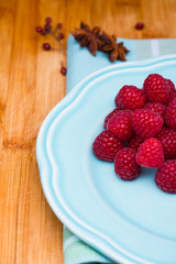 Raspberry on blue plate