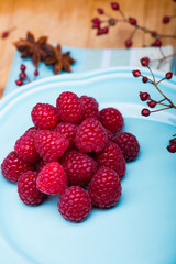 Raspberry on blue plate