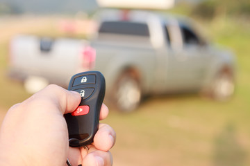 hand presses on the remote control car alarm systems