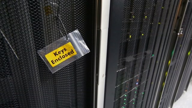 Packet with Key enclosure inscription on door of server rack