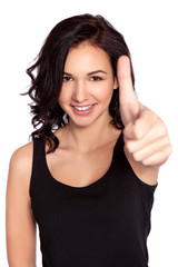 Fototapeta premium Close-up of a young woman showing thumbs up