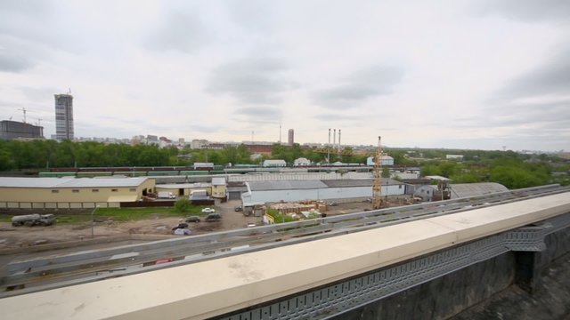 Cars on roof parking and industrial zone near shopping center