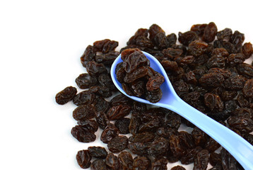 Dried raisins on a white background