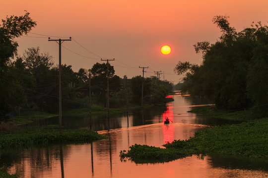Sunset over the canal in rural of thailand