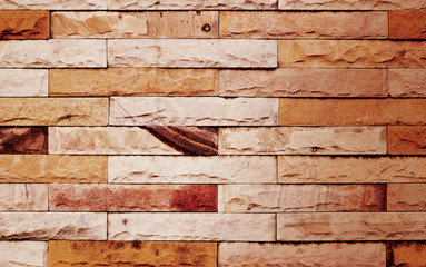 vintage color tone modern stone wall for background, warm tone