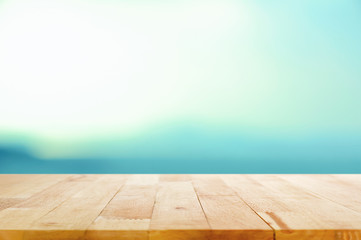 Naklejka na ściany i meble Wood table top on white blue gradient background