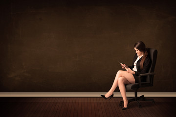 Businesswoman holding high tech tablet on background with copysp