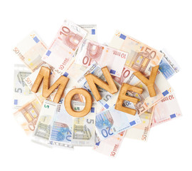Word Money over the pile of money